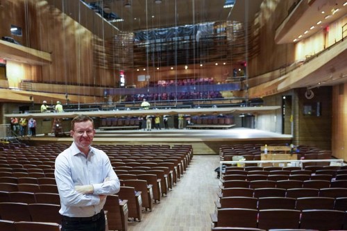 FILE - Henry Timms, President and CEO at the Lincoln Center for the Performing Arts, poses for a portrait in the newly renovated Wsu Tsai Theater at David Geffen Hall, Thursday, Aug. 25, 2022, at the Lincoln Center in New York. The 47-year-old announced his resignation Wednesday as of the summer to become CEO of the public relations firm the Brunswick Group. He took over Lincoln Center in May 2019, becoming its sixth leader in 5½ years. (AP Photo/Mary Altaffer, File)