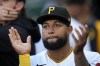 FILE - Pittsburgh Pirates' Canaan Smith-Njigba walks in the dugout during a baseball game against the Cincinnati Reds in Pittsburgh, Thursday, April 20, 2023. There will be another member of the Smith-Njigba family playing for a Seattle team after the Mariners claimed outfielder Canaan Smith-Njigba off waivers on Wednesday, Feb. 7, 2024. (AP Photo/Gene J. Puskar, File)