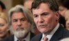Minister of Transport Pablo Rodriguez looks on as Minister of Public Safety, Democratic Institutions and Intergovernmental Affairs Dominic LeBlanc speaks about auto theft in Canada, Wednesday, February 7, 2024 in Ottawa. THE CANADIAN PRESS/Adrian Wyld