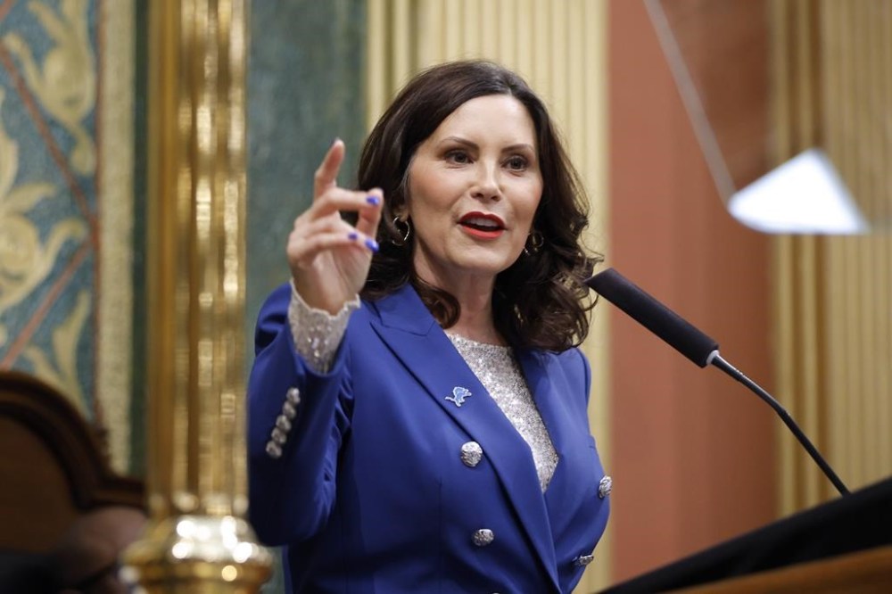 FILE - Michigan Gov. Gretchen Whitmer delivers her State of the State address to a joint session of the House and Senate, Wednesday, Jan. 24, 2024, at the state Capitol in Lansing, Mich. Whitmer on Wednesday, Feb. 7, 2024, presented a $80.7 billion budget Wednesday that aims to boost education spending and deliver on her promise to provide students free education from preschool through community college. (AP Photo/Al Goldis, File)