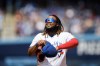 Toronto Blue Jays first baseman Vladimir Guerrero Jr. (27) fixes his hat in the infield during the second inning of MLB baseball action against the Los Angeles Angels in Toronto, Sunday July 30, 2023. Toronto Blue Jays slugger Vladimir Guerrero Jr. won his arbitration case on Wednesday and will receive a salary of US$19.9 million this season. THE CANADIAN PRESS/Cole Burston
