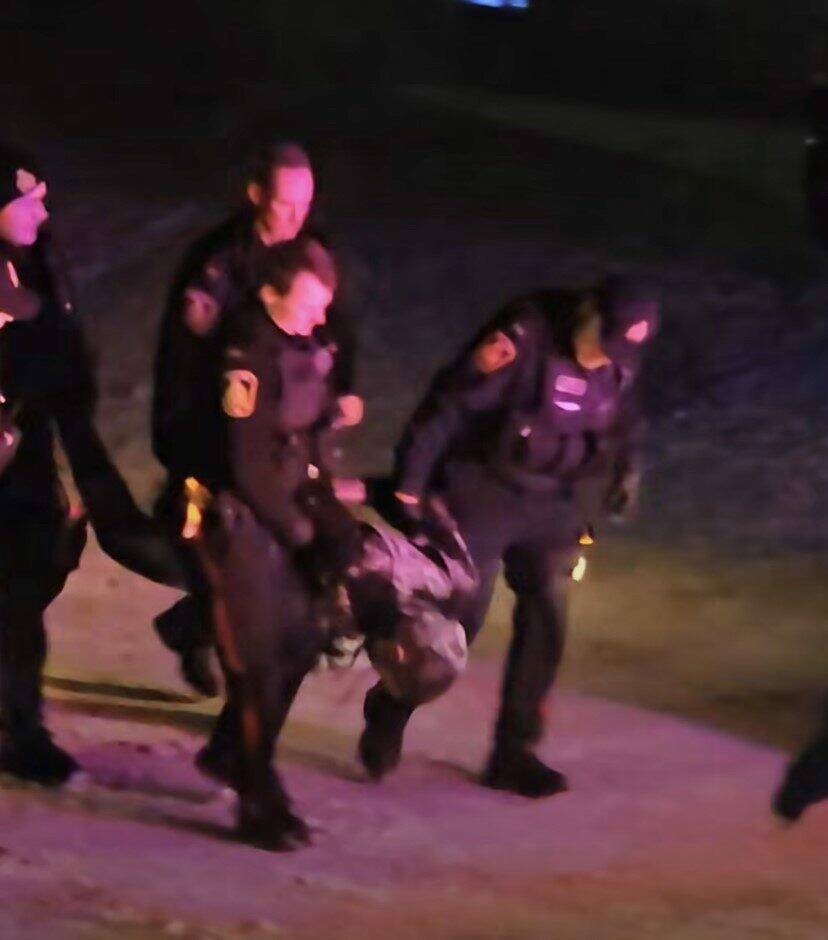 Screen grab from a video circulating online shows officers with the 35-year-old man in distress early Saturday.