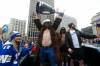 QB Chris Streveler cemented his celebrity status when he showed up to the Grey Cup parade bare-chested, donning a white cowboy hat, long brown fur coat and gold chain, while chugging beers. (John Woods / The Canadian Press files