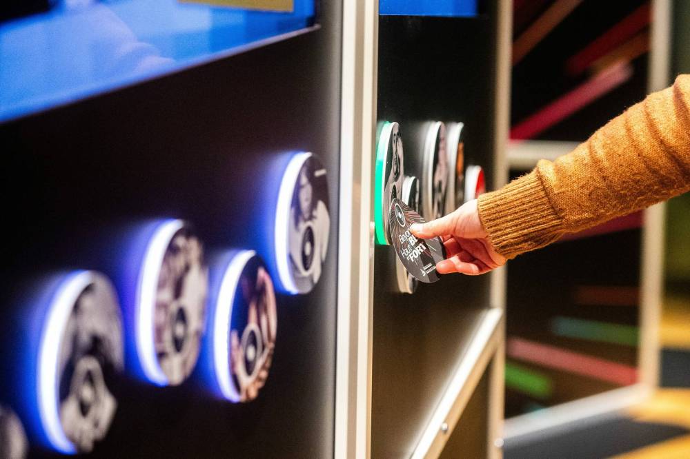 MIKAELA MACKENZIE / WINNIPEG FREE PRESS
                                Peristerakis demonstrates RFID interactive features that are part of the exhibition’s multi-genre approach that examines the different ways popular music has been used for advocacy.