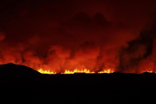 A view of the volcano erupting, north of Grindavík, Iceland, Thursday, Feb. 8, 2024. Iceland’s Meteorological Office says a volcano is erupting in the southwestern part of the country, north of a nearby settlement. The eruption of the Sylingarfell volcano began at 6 a.m. local time on Thursday, soon after an intense burst of seismic activity. (AP Photo/Marco Di Marco)