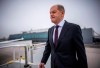 German Chancellor Olaf Scholz boards an Airbus of the Air Force's Air Wing at the military section of Berlin Brandenburg Airport to fly to the USA, in Schönefeld, Germany, Thursday, Feb. 8, 2024. Scholz pushed for further U.S. and European aid for Ukraine as he set off Thursday for a visit to Washington, declaring that it's time to send Russian President Vladimir Putin a “clear signal” that the West won't let up on supporting Kyiv. Scholz is due to meet members of the U.S. Congress on Thursday and President Joe Biden on Friday. (Michael Kappeler/dpa via AP)