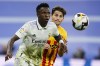 FILE - Real Madrid's Vinicius Junior, left is chased by Girona's Toni Villa during a Spanish La Liga soccer match between Real Madrid and Girona at the Santiago Bernabeu stadium in Madrid, Spain, Sunday, Oct. 30, 2022. Little importance was given to Girona’s visit to Real Madrid this Saturday, Feb. 10, 2024, when the Spanish league published its calendar for the upcoming season. Six months later and the game at the Santiago Bernabeu will decide which team will be in pole position to win the title come May. (AP Photo/Jose Breton, File)