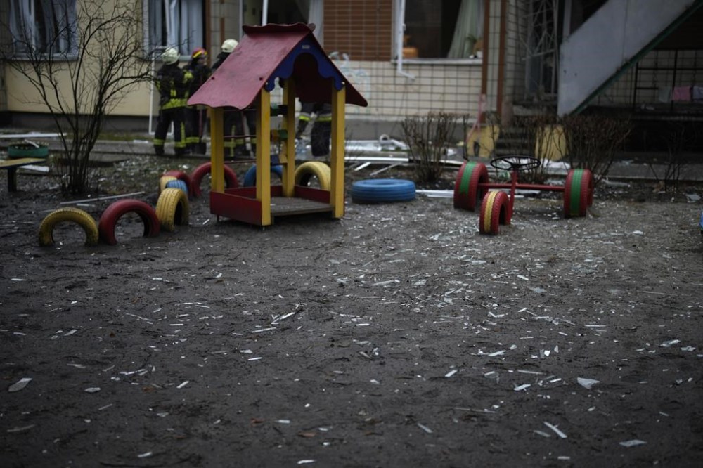 FILE - Shards of window glass are seen in the kindergarten at the scene where a helicopter crashed on civil infrastructure in Brovary, on the outskirts of Kyiv, Ukraine, Wednesday, Jan. 18, 2023. To start the Russian presidency of the U.N. Security Council the Russians chose one of the hottest issues of the Ukraine war — the fate of Ukrainian children taken to Russia. For the informal Security Council meeting, they chose as its briefer Maria Lvova-Belova, the Russian children's rights commissioner, who along with Putin is being sought by the International Criminal Court on war crimes charges. (AP Photo/Daniel Cole, File)