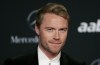 FILE - Irish singer Ronan Keating arrives for the Laureus Awards in Abu Dhabi, United Arab Emirates, on Feb. 7, 2011. Chorley could be the next soccer club from the English non-leagues to be given a sprinkle of celebrity stardust. The sixth-tier team from northwest England says it is in “ongoing discussions” with Boyzone in hopes of the Irish boy band fronted by Ronan Keating becoming “the face of the football club.” (AP Photo/Nousha Salimi, File)