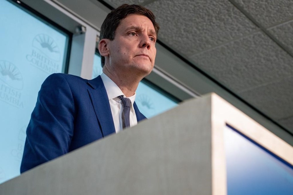 Premier David Eby says the first purchase using the government's Rental Protection Fund will save 290 affordable rental units in two housing co-ops that have expired leases and were facing the prospect of being sold out from under the residents. Eby listens to a question from a reporter during a news conference in Vancouver on Monday, Feb. 5, 2024. THE CANADIAN PRESS/Ethan Cairns