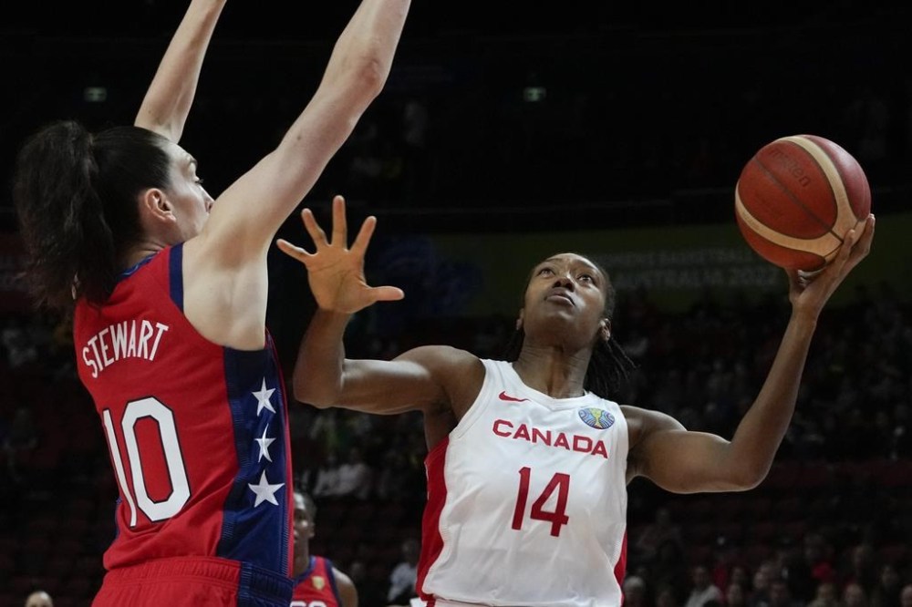 Canada's Kayla Alexander, right, lays up for a shot at goal as United States' Breanna Stewart attempts to block during their semifinal game at the women's Basketball World Cup in Sydney, Australia, Friday, Sept. 30, 2022. Alexander led the way with 15 points and 13 rebounds as Canada took a 67-55 opening win over host Hungary on Thursday in a FIBA Olympic Qualifying tournament.THE CANADIAN PRESS/AP-Mark Baker