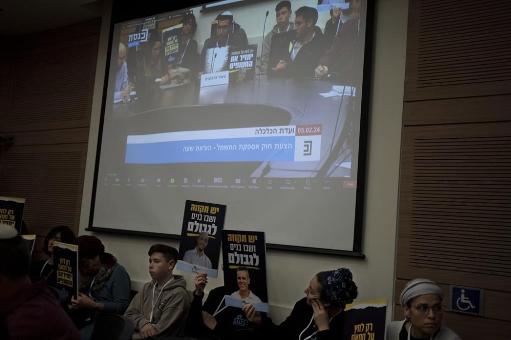 Relatives and supporters of Israelis held hostage by Hamas attend a committee hearing at the Knesset, Israel's parliament, in Jerusalem, Monday, Feb. 5, 2024. Across Israel, the chants of
