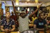 Watching the match in a Johannesburg, South Africa pub, South African supporters react to their team missing a goal Wednesday, Feb. 7, 2024 in Johannesburg, South Africa, during the African Cup of Nations semi-final soccer match between Nigeria and South Africa played in Bouake, Ivory Coast. (AP Photo/Shiraaz Mohammed)