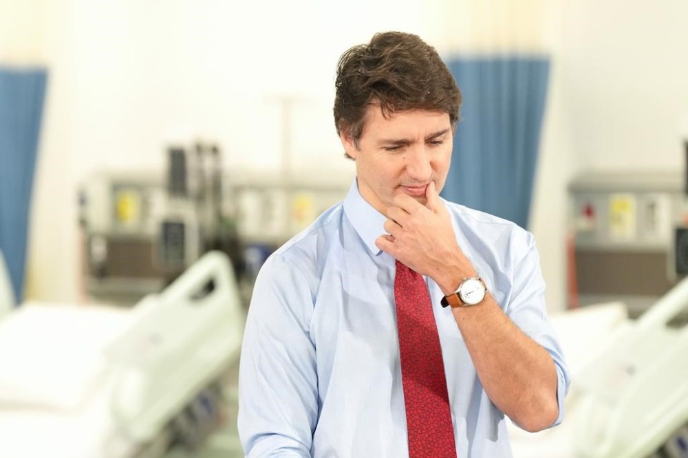 Prime Minister Justin Trudeau attends an announcement at Seneca College, in King City, Ont., Friday, Feb. 9, 2024. Trudeau trash-talked BCE Inc.'s widespread layoffs Friday, calling cuts to Bell Media a