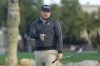 Andrew Novak tries to coax a putt on the second hole during the continuation of the first round of the Phoenix Open golf tournament Friday, Feb. 9, 2024, in Scottsdale, Ariz. (AP Photo/Ross D. Franklin)