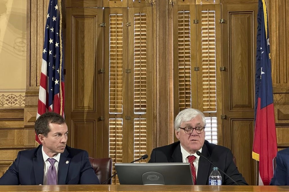 Georgia state Sen. Bill Cowsert, R-Athens, right, speaks as state Sen Greg Dolezal, R-Cumming, looks on, Friday, Feb. 9, 2024, at the Georgia Capitol in Atlanta, during the first meeting of a state Senate committee to investigate Fulton County District Attorney Fani Willis. Cowsert says an inquiry into whether Willis committed misconduct won't be a partisan