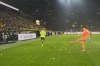 Dortmund's goalkeeper Gregor Kobel kicks tennis balls thrown on the field by protesting supporters during the German Bundesliga soccer match between Borussia Dortmund and SC Freiburg in Dortmund, Germany, Friday, Feb. 9, 2024. (AP Photo/Martin Meissner)