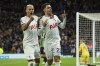 Tottenham's Brennan Johnson, right, is congratulated by Richarlison after scoring his side's 2nd goal during the English Premier League soccer match between Tottenham Hotspur and Brighton & Hove Albion at the Tottenham Hotspur Stadium in London, Saturday, Feb. 10, 2024. (AP Photo/Ian Walton)