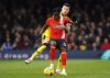 Sheffield United's Anel Ahmedhodzic, left, and Luton Town's Elijah Adebayo battle for the ball during the English Premier League soccer match between Luton Town and Sheffield United at Kenilworth Road, Luton, England, Saturday Feb. 10, 2024. (Robbie Stephenson/PA via AP)