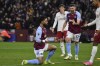 Aston Villa's Douglas Luiz, centre, celebrates after scoring his side's opening goal during the English Premier League soccer match between Aston Villa and Manchester United at the Villa Park stadium in Birmingham, England, Sunday, Feb. 11, 2024. (AP Photo/Rui Vieira)