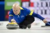 Team Alberta skip Kevin Koe makes a shot against Team NWT at the 2023 Tim Hortons Brier in London, Ontario on Thursday March 9, 2023.&nbsp;Alberta's Aaron Sluchinski, Manitoba's Reid Carruthers and wild-card Kevin Koe completed the 18-team field for the national men's curling championship Sunday. THE CANADIAN PRESS/Frank Gunn
