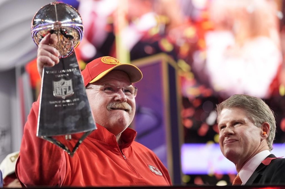 Kansas City Chiefs head coach Andy Reid holds the Vince Lombardi Trophy as Kansas City Chiefs chairman and CEO Clark Hunt looks on after the NFL Super Bowl 58 football game against the San Francisco 49ers on Sunday, Feb. 11, 2024, in Las Vegas. The Chiefs won 25-22.(AP Photo/Ashley Landis)