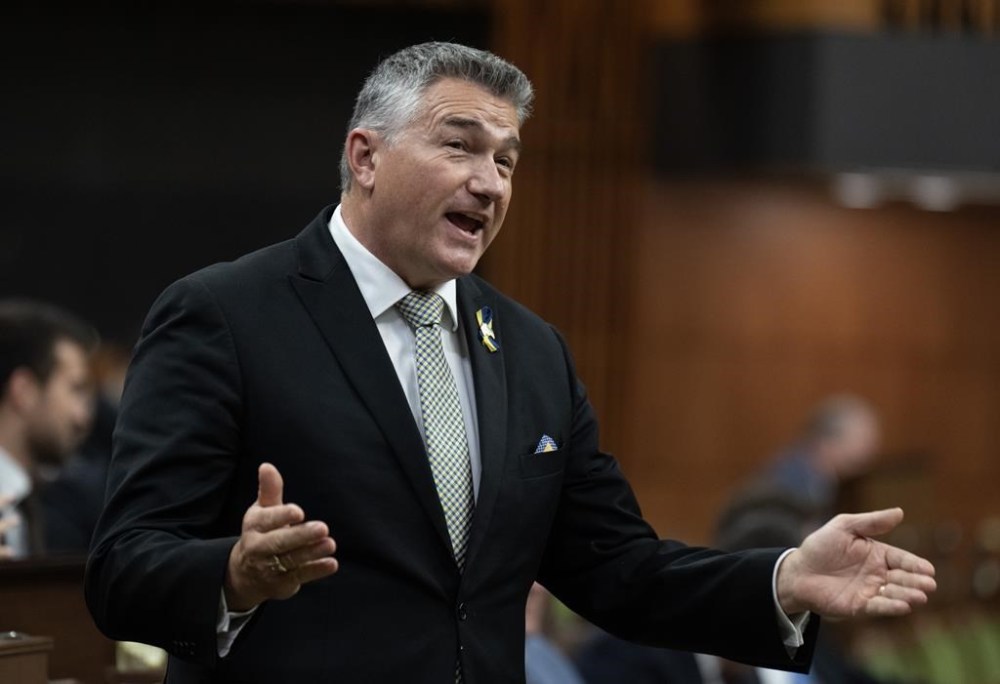 Conservative MP James Bezan rises during Question Period, Friday, October 20, 2023 in Ottawa. Bezan is promising that if the party forms government after the next election, it would renegotiate a trade deal with Ukraine, after voting against its current one. THE CANADIAN PRESS/Adrian Wyld