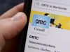 A person navigates to the on-line social-media pages of the Canadian Radio-television and Telecommunications Commission (CRTC) on a cell phone in Ottawa on Monday, May 17, 2021. New Brunswick-based rural internet company Xplore Inc. says a national framework that allows smaller providers to offer services to customers by using larger companies' fibre networks would give residents of remote regions more affordable options. THE CANADIAN PRESS/Sean Kilpatrick