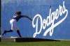 Los Angeles Dodgers starting pitcher Tyler Glasnow throws during spring training baseball workouts at Camelback Ranch in Phoenix, Tuesday, Feb. 13, 2024. (AP Photo/Ashley Landis)
