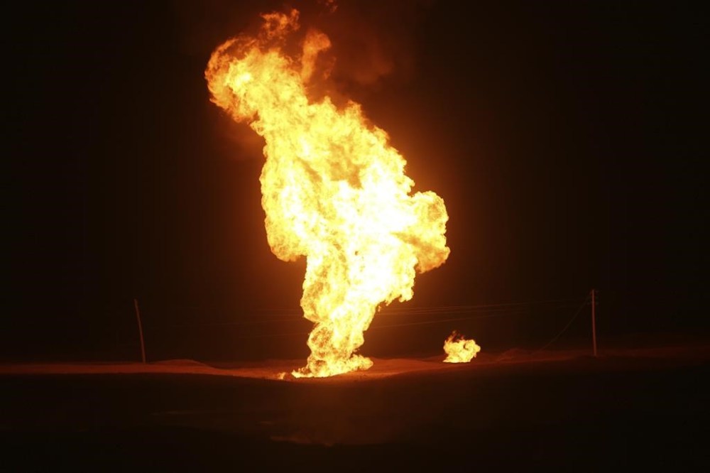 Flames leap into the air after a natural gas pipeline explodes outside the city of Boroujen in the western Chaharmahal and Bakhtiari province, Iran, in early Wednesday, Feb. 14, 2024. Explosions struck a natural gas pipeline in Iran early Wednesday, with an official blaming the blasts on a