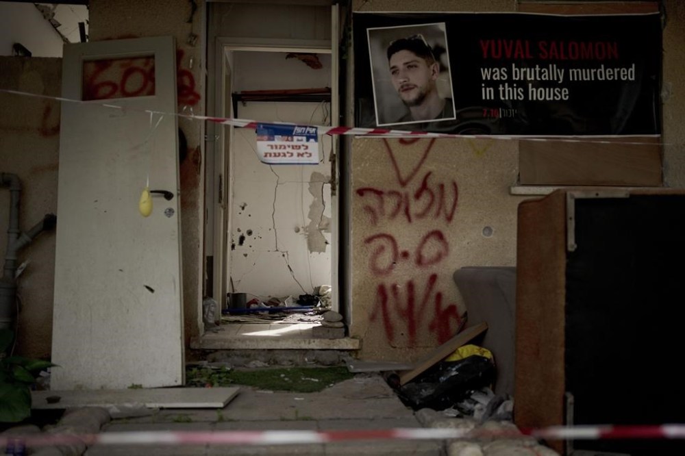 The home of Yuval Salomon, killed in Kibbutz Kfar Azza, southern Israel, near the Gaza border, is shown on Tuesday, Feb. 13, 2024, the site of a cross-border attack by Hamas on Oct. 7, 2023. (AP Photo/Maya Alleruzzo)