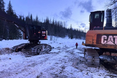 In this image provided by the Cooper Landing Emergency Services, emergency personnel respond to reports of an avalanche on Tuesday, Feb. 13, 2024, in Cooper Landing, Alaska. One backcountry skier died and two others were injured in an avalanche on Alaska's Kenai Peninsula, as warm weather raises the risk for such events in the state. (Clay Adam/Cooper Landing Emergency Services via AP)