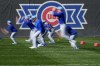 Chicago Cubs players run during a MLB baseball spring training workout, Wednesday, Feb. 14, 2024, in Mesa, Ariz. (AP Photo/Matt York)