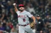 FILE -Los Angeles Angels third baseman Mike Moustakas makes a play during a baseball game against the Seattle Mariners, Tuesday, Sept. 12, 2023, in Seattle. The Chicago White Sox have agreed to a minor league contract with Mike Moustakas that includes an invitation to major league camp for spring training. The White Sox announced the deal with the veteran infielder on Wednesday night, Feb. 14, 2024. (AP Photo/Lindsey Wasson, File)