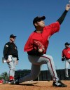 FILE - Cincinnati Reds pitcher Jung Keun Bong throws as pitching coach Don Gullett, left, watches during baseball spring training Feb. 19, 2005, in Sarasota, Fla. Gullett, a former major league pitcher and coach who played for four consecutive World Series champions in the 1970s, died Wednesday, Feb. 14, 2024. He was 73. The Reds, New York Yankees and Baseball Hall of Fame all paid tribute to Gullett in social media posts. There was no information provided on his death, but the Cincinnati Enquirer reported he had recent health issues. (AP Photo/Al Behrman, File)
