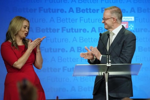 FILE - Anthony Albanese, right, smiles as his partner Jodie Haydon blows him a kiss while thanking supporters at a Labor Party event in Sydney, Australia, May 22, 2022, following a national election. Albanese has become the first Australian prime minister to get engaged while in office, revealing Thursday, Feb. 15, 2024, that his partner Haydon accepted his marriage proposal on Valentine's Day. (AP Photo/Rick Rycroft, File)