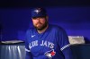 Toronto Blue Jays manager John Schneider sits in the dugout before American League action against the Seattle Mariners in Toronto on Friday, April 28 2023. Schneider says his team has a sense of urgency to get results this season after a disappointing exit in the wild-card playoff round last year. THE CANADIAN PRESS/Chris Young