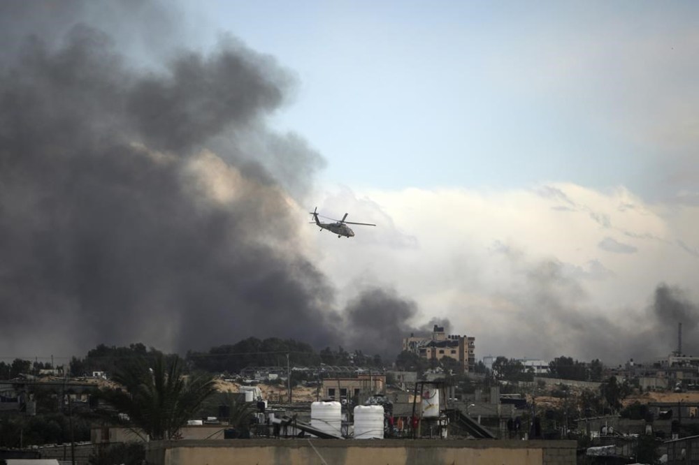 Omar Khan was organizing sessions connecting Canadians to Muslim therapists and setting up forums to address mental-health fallout related to the Israel-Hamas war when he learned his online therapy platform had lost access to its banking service without explanation. An Israeli helicopter flies over Khan Younis, Gaza Strip, Thursday, Feb. 15, 2024. THE CANADIAN PRESS/AP/Mohammed Dahman