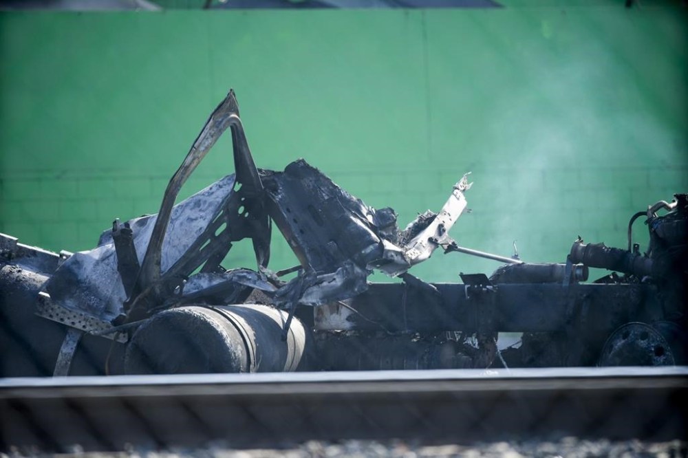 A damaged truck is seen on Thursday, Feb. 15, 2024 in the Wilmington section of Los Angeles. Several Los Angeles firefighters were injured, two critically, when an explosion occurred as they responded to a truck with pressurized cylinders that were on fire early Thursday, authorities said. (AP Photo/Eric Thayer)