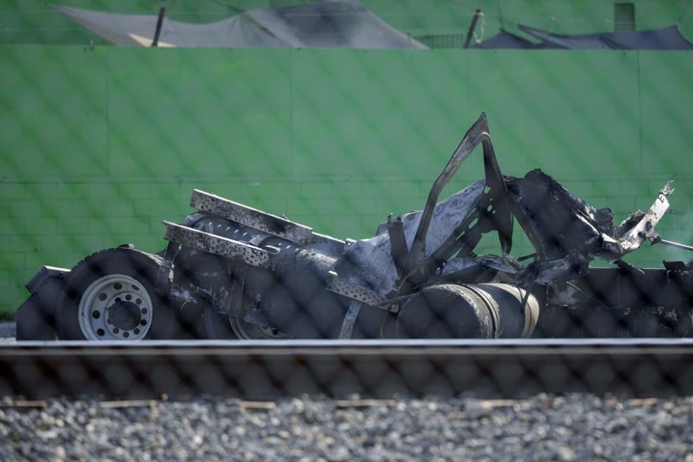 This tractor portion of a big rig is seen damaged on Thursday, Feb. 15, 2024 in the Wilmington section of Los Angeles. Several Los Angeles firefighters were injured, two critically, when an explosion occurred as they responded to a truck with pressurized cylinders that were on fire early Thursday, authorities said. (AP Photo/Eric Thayer)