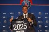 FILE - PSG striker Kylian Mbappe shows his jersey during a press conference Monday, May 23, 2022 at the Paris des Princes stadium in Paris. Mbappe has told Paris Saint-Germain he will leave the club at the end of the season, it was reported on Thursday, Feb. 15, 2024. (AP Photo/Michel Spingler, File)