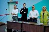 FILE - Russian opposition leader Alexei Navalny, 2nd left, and his lawyers Alexander Fedulov, left, Olga Mikhailova, right, and Vadim Kobzev, second right, are seen on a TV screen standing among his lawyers, as he appears in a video link provided by the Russian Federal Penitentiary Service, during a hearing in the colony, in Melekhovo, Vladimir region, about 260 kilometers (163 miles) northeast of Moscow, Russia, on Friday, Aug. 4, 2023. Russian authorities on Friday, Feb. 16, 2023, say Navalny, the fiercest foe of Russian President Vladimir Putin who crusaded against official corruption and staged massive anti-Kremlin protests, died in prison. He was 47. (AP Photo, File)