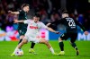Cologne's Max Finkgrafe is challenged by Bremen's Mitchell Weiser, left, and Romano Schmid during the Bundesliga soccer match between FC Koln and Werder Bremen at RheinEnergieStadion, Cologne, Germany, Friday Fab. 16, 2024. (Rolf Vennenbernd/dpa via AP)