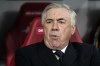 Real Madrid's head coach Carlo Ancelotti takes his seat for the Champions League round of 16 first leg soccer match between RB Leipzig and Real Madrid at the Red Bull arena stadium in Leipzig, Germany, Tuesday, Feb. 13, 2024. (AP Photo/Matthias Schrader)