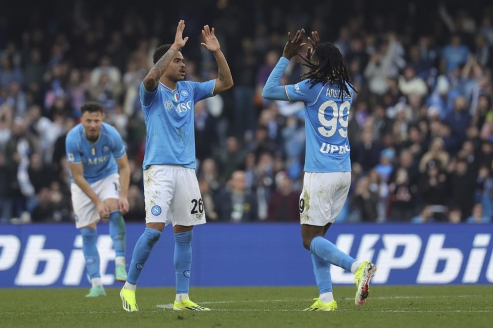 Napoli's Cyril Ngonge, centre, celebrates with teammates after scoring his side's first goal during the Serie A soccer match between Napoli and Genoa at the Diego Maradona Stadium in Naples, Italy, Feb. 17, 2024. (Alessandro Garofalo/LaPresse via AP)