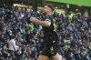 Dortmund's Niclas Fuellkrug celebrates after scoring the opening goal during the Bundesliga soccer match between VfL Wolfsburg and Borussia Dortmund in Wolfsburg, Germany, Saturday, Feb. 17, 2024. (Swen Pfoertner/dpa via AP)
