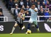 Newcastle's Miguel Almiron, left, and Bournemouth's Lloyd Kelly challenge for the ball during the English Premier League soccer match between Newcastle and Bournemouth at the St James' Park, in Newcastle, England, Saturday, Feb. 17, 2024. (Owen Humphreys/PA via AP)