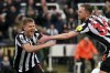 Newcastle United's Matt Ritchie, left, celebrates with Sean Longstaff after scoring his side's second goal during the English Premier League soccer match between Newcastle and Bournemouth at the St James' Park, in Newcastle, England, Saturday, Feb. 17, 2024. (Owen Humphreys/PA via AP)