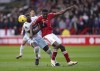West Ham United's Kurt Zouma and Nottingham Forest's Taiwo Awoniyi, right, vie for the ball, during the English Premier League soccer match between Nottingham Forest and West Ham United, at the City Ground, in Nottingham, England, Saturday, Feb. 17, 2024. (Mike Egerton/PA via AP)
