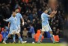 Manchester City's Rodri, right, celebrates after scoring his side's first goal during the English Premier League soccer match between Manchester City and Chelsea at the Etihad stadium in Manchester, England, Saturday, Feb. 17, 2024. (AP Photo/Dave Thompson)